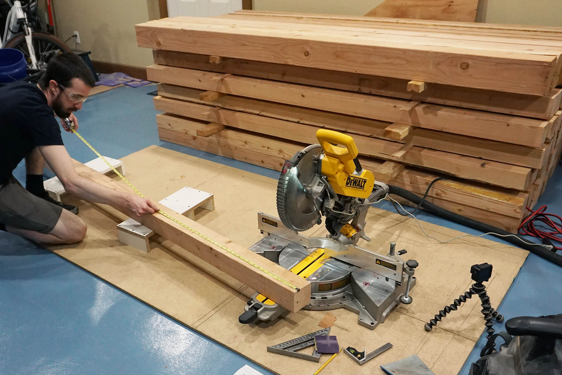 Cutting lumber as part of prefabrication.