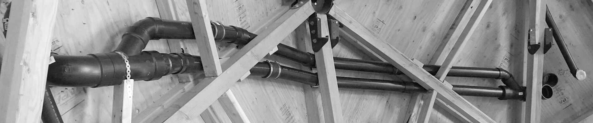 A close-up view of the pipes, ducting, and custom loft brackets in the walls of the Mini Dome.
