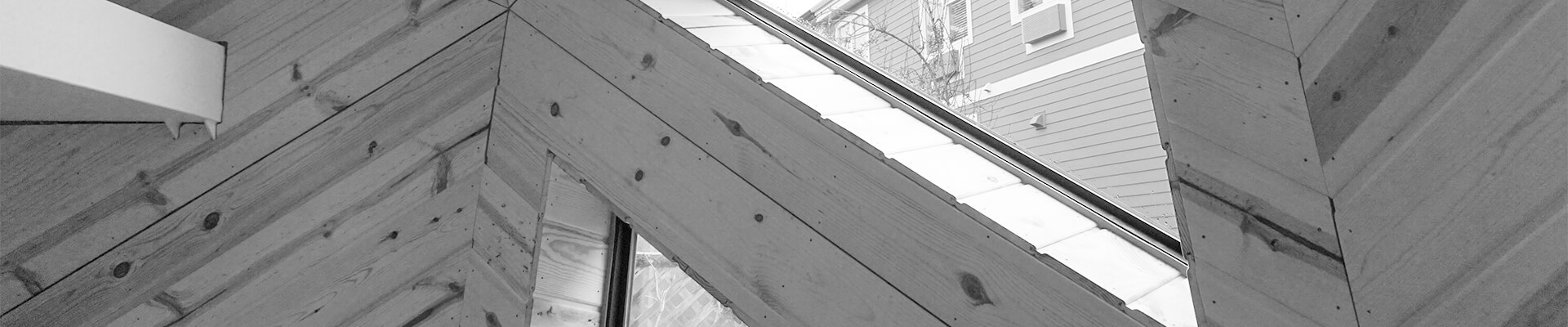 A close-up view of the wood paneling in the Mini Dome in black and white.